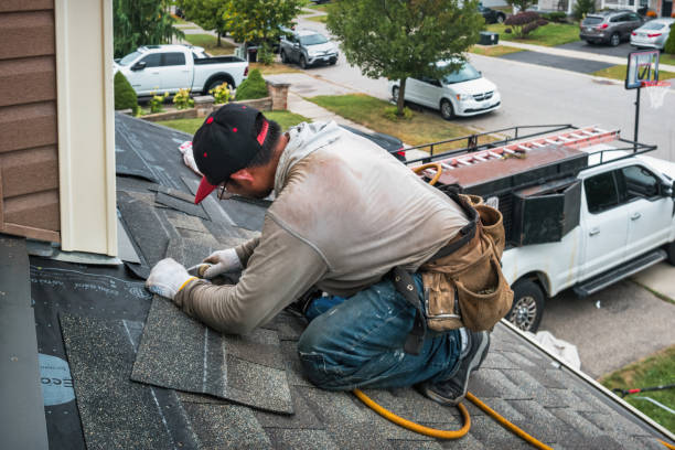 Professional Roofing technician working in Thompson, OH